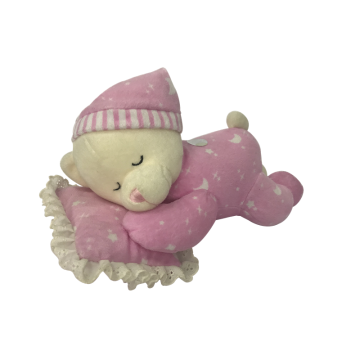 Πλούσια αρκουδάκι κοιμάται στα μαξιλάρια ροζ